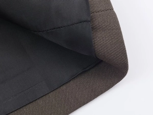 Macro detail of dark brown twill fabric with black lining for this women's suit set