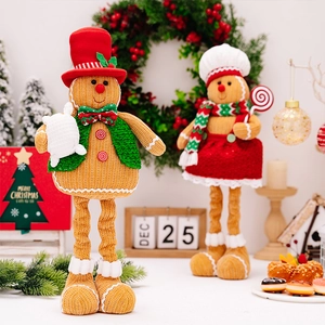 Pair of adjustable plush gingerbread dolls with extendable legs for Christmas decor