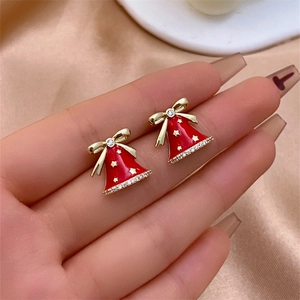 Christmas bell stud earrings in red enamel with gold stars and sparkling zircon bow detail