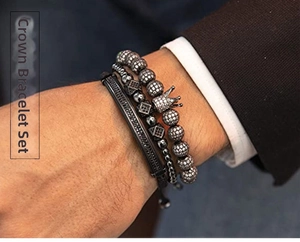 Macro detail of men's crown bead bracelet set featuring cubic zirconia in gunmetal finish
