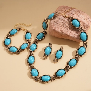 Detailed set of vintage ethnic jewelry with turquoise resin and golden metal texture