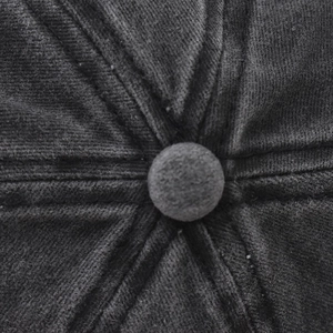 Detail view of the deep gray washed cotton cap top button with reinforced stitching