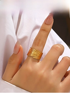 Detailed view of wide 18K gold plated feather ring with layered metal textures