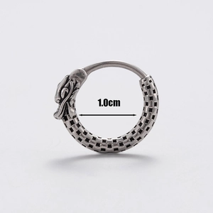 Macro detail of vintage silver dragon head earring with 1.0cm inner diameter measurement