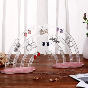 Rainbow acrylic earring stand with pink cloud base showing multiple jewelry hanging slots