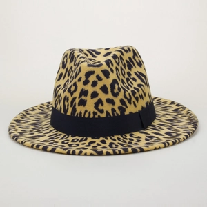 Close-up of leopard print fedora hat featuring wide brim and black decorative band