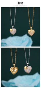 Detailed macro view of heart pendant with cubic zirconia and ribbon design