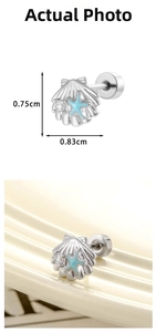 Detailed tile display of a micro-set zircon shell and blue starfish cartilage stud earring