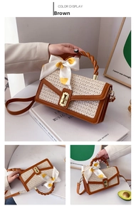 Detail of woven handbag with twisted handle, bow scarf and metallic gold twist lock