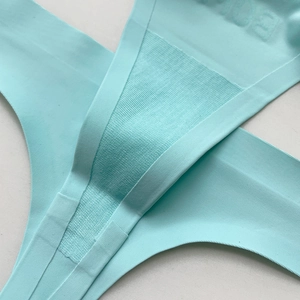 Mint green seamless ice silk thong with breathable mesh texture for sports