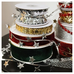 Close-up of velvet ribbons and metallic star garlands for DIY Christmas tree decorations