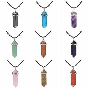 Nine crystal hexagonal prism pendants in various natural stones with black cords