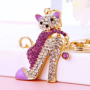 Detailed close-up of crystal cat high heel keychain with pink rhinestones and gold clasp
