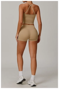 Detail showing cross-back design and high-waist fit of khaki athletic yoga set