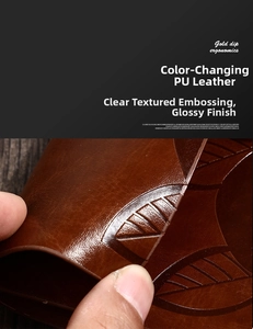Close-up of flexible brown PU leather notebook cover with embossed leaf vein texture