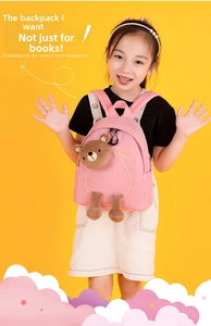 Pink toddler backpack with 3D cartoon bear and embroidery on a bright background