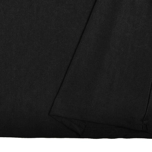 Close-up detail of black fabric texture and stitching on summer halter dress