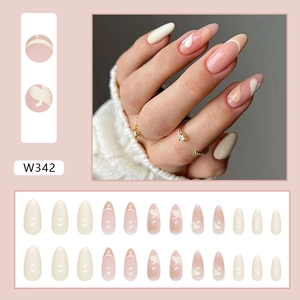 Almond press-on nails with minimalist French heart design and soft nude pink wave patterns