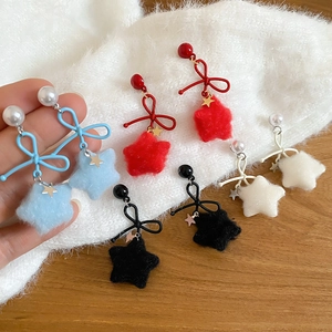 Detailed close-up of bowknot earrings with velvet stars and pearls in multiple colors