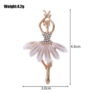 Elegant gold ballerina brooch with white enamel skirt and crystals, 4.8cm height