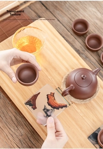 Japanese resin tea coaster with wood inlay and ink smoke art shown in a tea ceremony setting