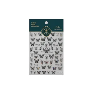 Stickers ongles papillons holographiques laser avec reflets arc-en-ciel sur fond blanc