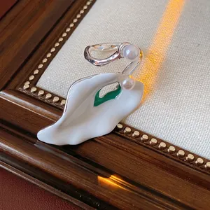 Vintage style floral enamel brooch with white pearls and silver metal finish