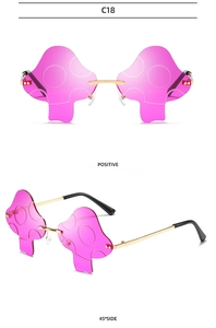 Detailed front and side views of rimless mushroom sunglasses in pink with gold metal frame