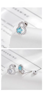 Detail of star zircon gourd earrings with blue gemstone and secure screw back closure