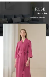 Detail of rose red waffle weave bathrobe showing texture, V-neck, and pockets