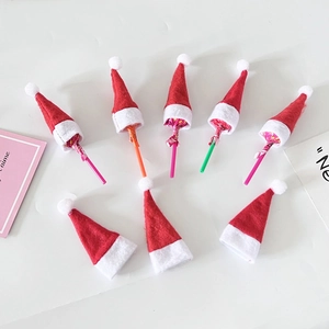 Mini red and white non-woven Christmas hats for lollipop decoration and party favors