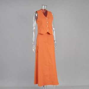 Detail of orange cotton linen vest and A-line maxi skirt set on a mannequin