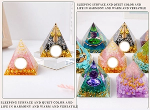 Detailed view of colorful resin Orgone energy pyramids with crystal stones and metal coils
