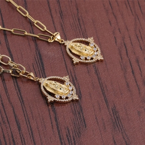 Golden Virgin Mary paperclip chain necklace featuring oval pendant with zircon setting