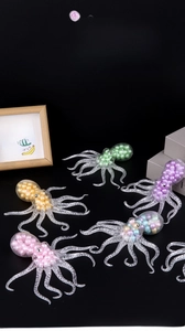 Close-up of octopus stress toys with colorful beads inside showing soft texture