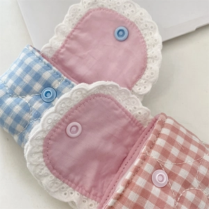 Close-up of blue and pink gingham cotton earphone pouches with delicate white lace trim