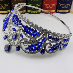 Macro detail of silver bridal crown featuring blue marquise-cut gems and clear rhinestones