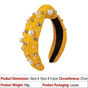 Detail of yellow knotted headband with white pearls, sparkling rhinestones, and dimensions