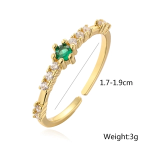 Detail view of gold geometric ring with green zircon showing 1.7-1.9cm diameter size
