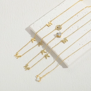 Elegant gold zircon necklaces set featuring MAMA letters, rose, and heart pendants
