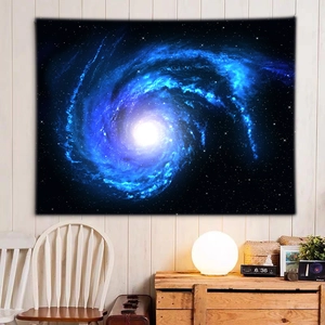 Detailed close-up of a dreamy galaxy wall tapestry with a blue nebula pattern in a bedroom