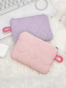 Quilted zipper pouch for cosmetics and accessories in pink and purple colors
