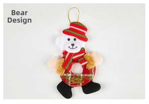 Detail of Christmas plush bear ornament with striped hat and Merry Christmas wreath