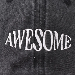 Washed cotton baseball cap with white embroidered AWESOME text in black color