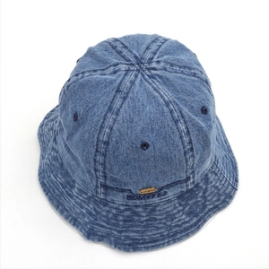 Detailed texture of washed denim sun hat with metallic JHMY logo and stitch details