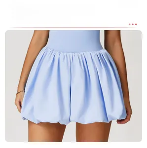 Detail of light blue tennis dress featuring a stylish puffed bubble hem design