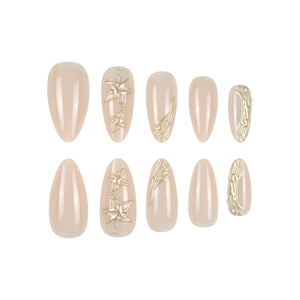 Sweet 3D almond press-on nails with golden stars and luxury nude pink texture