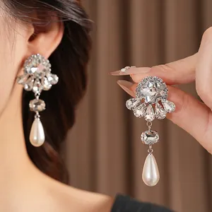 Elegant vintage silver flower earrings with crystals and large white teardrop pearls