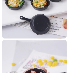 Detailed scale view of a miniature frying pan model with realistic fried rice food art