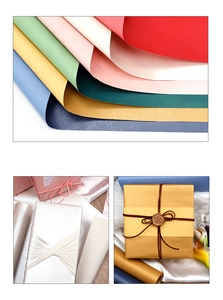 Detail of pearlescent gift wrapping paper with metallic finish and wax seal accents